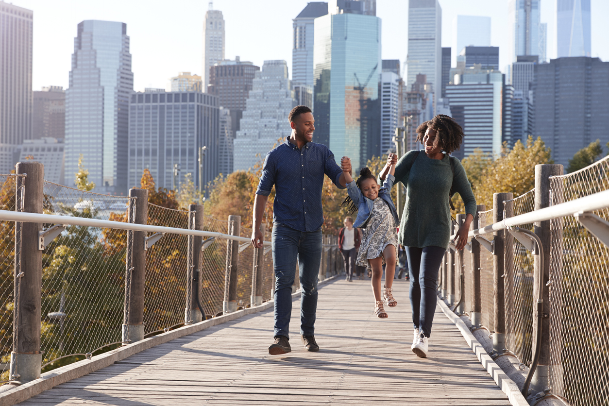 family running through a field living pain free